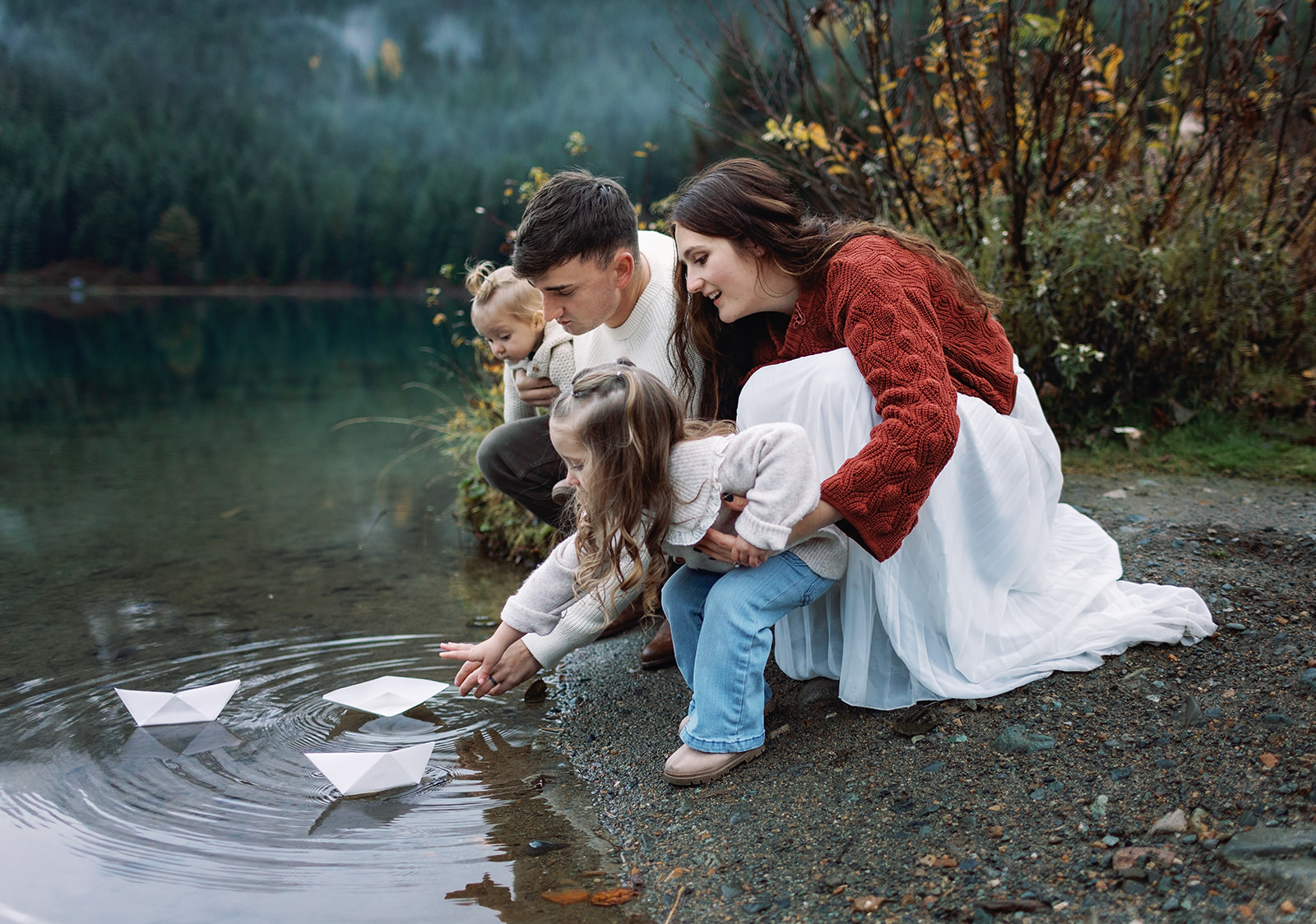 rainy family playing in water in Seattle