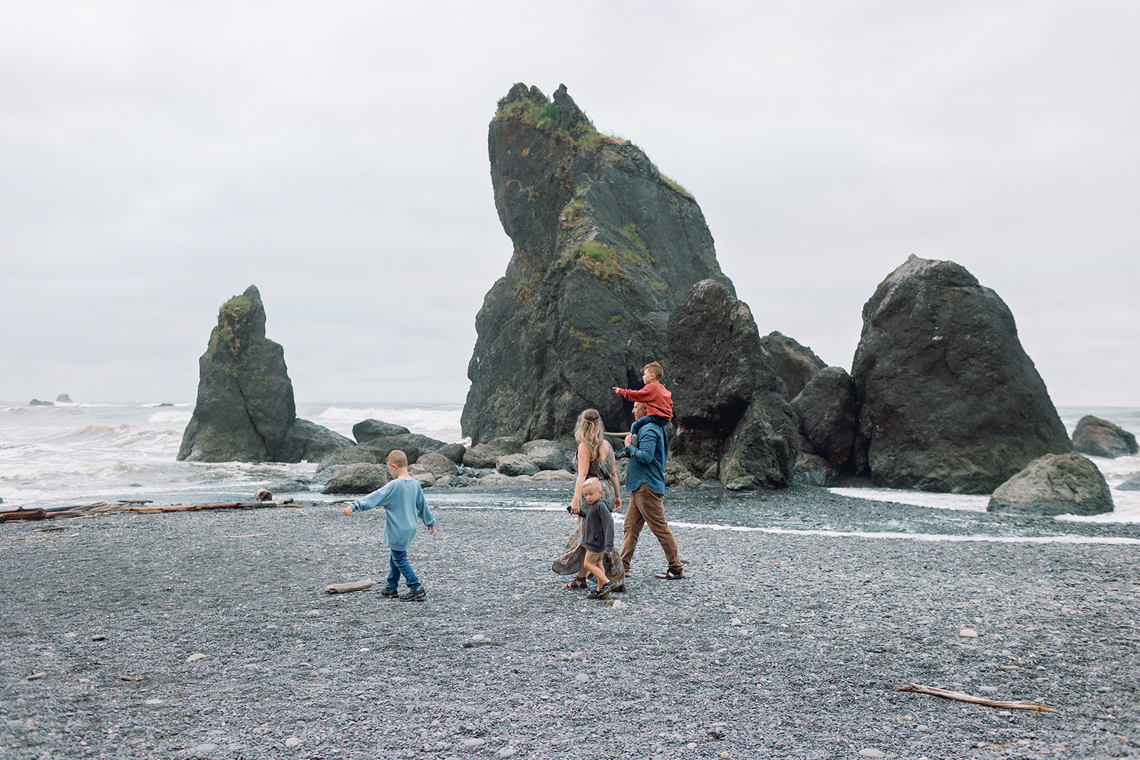 ruby beach family jagged ocean rock in background