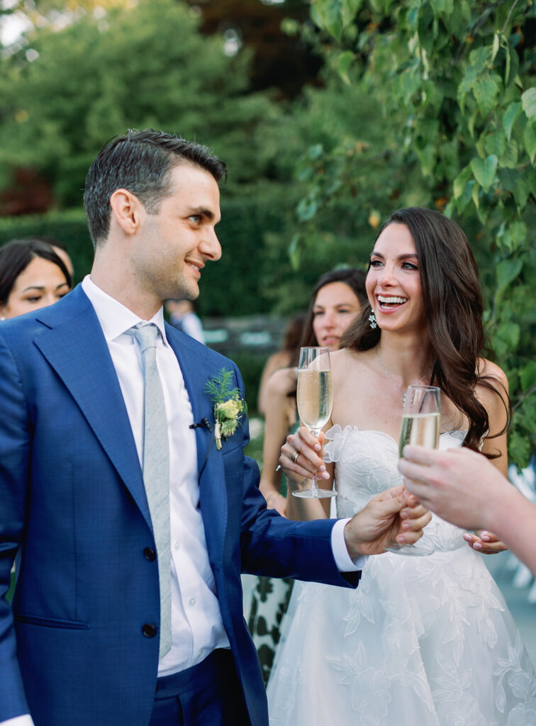 Candid moment during cocktail hour at Inn at Taughannock Falls