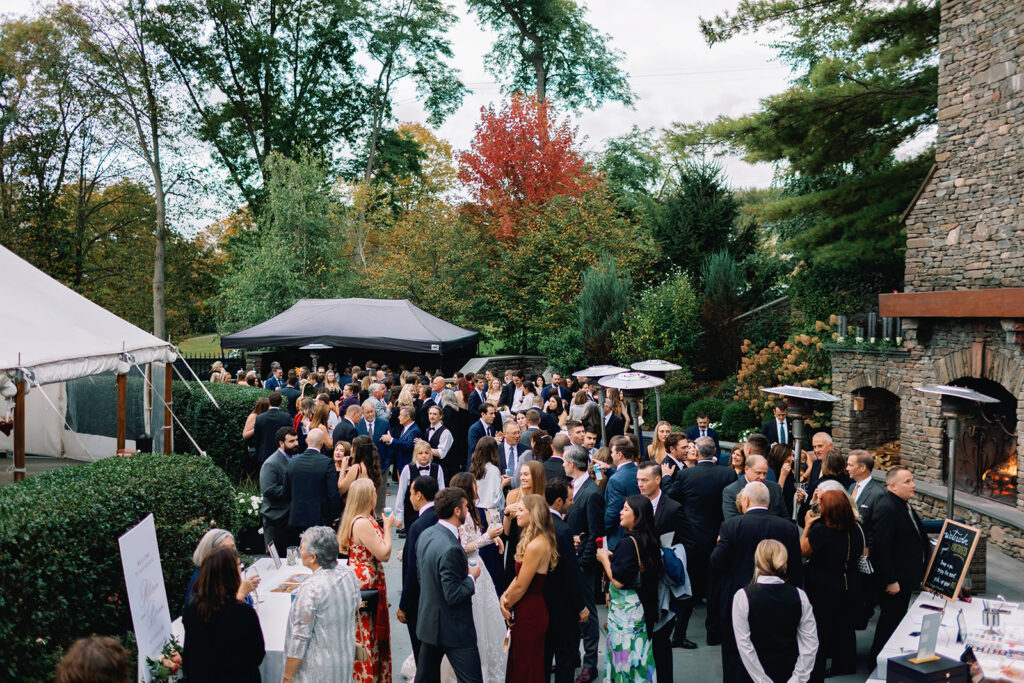 Guests gathered outdoors during cocktail hour at Inn at Taughannock Falls