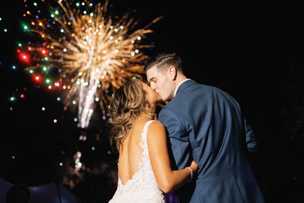 Documentary wedding moment with fireworks at Inn at Taughannock Falls Finger Lakes NY